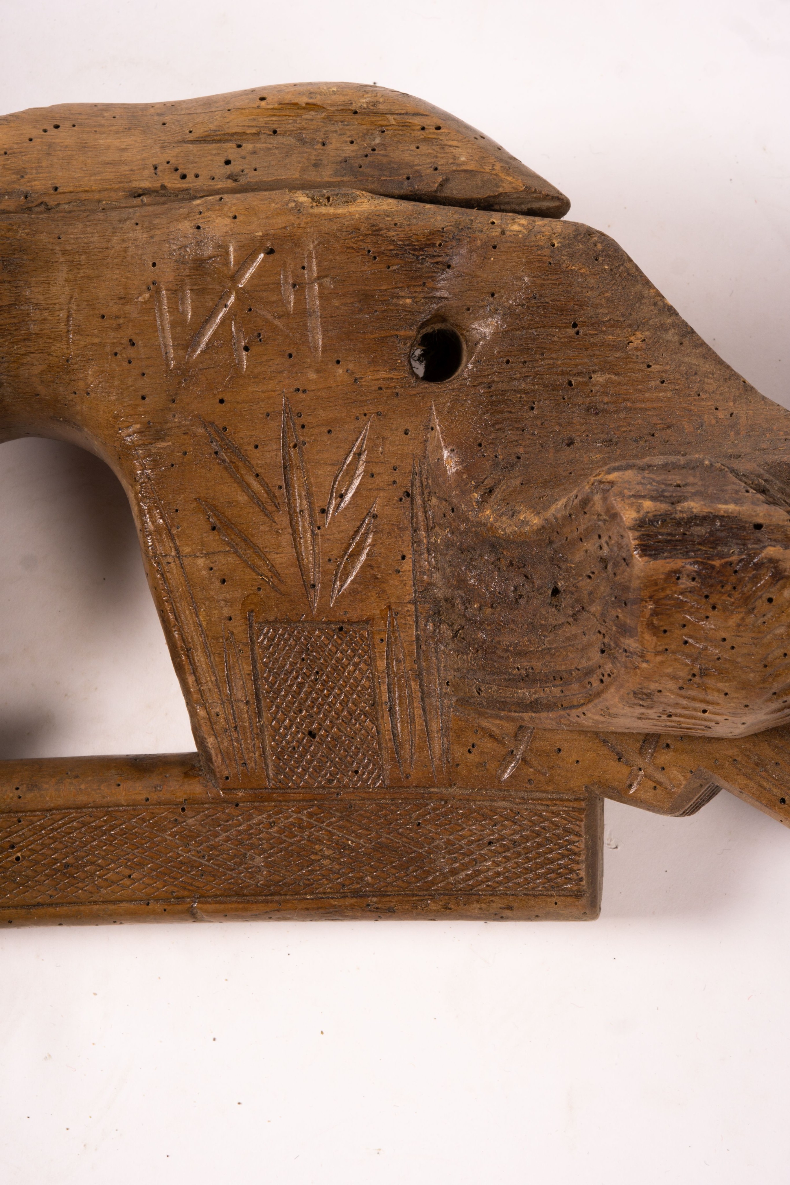 A 19th century Spanish carved fruitwood ox yoke, length 108cm